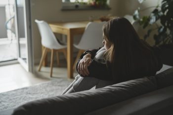 caucasian-sad-woman-sitting-at-the-sofa-with-depre-2023-11-27-05-00-02-utc-min(1)