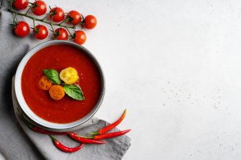gazpacho-soup-with-tomato-and-ingredients-on-white-2023-04-26-20-00-51-utc-min