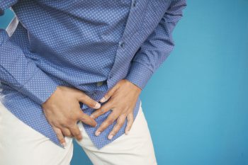 the concept of prostate and bladder problem, crotch pain of a young person .