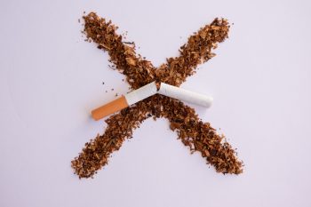 Tobacco and broken cigarette. Stop smoking. Cigarette, nicotine damages, lungs ruined by smoke. World no tobacco day Stop smoking message. Copy space